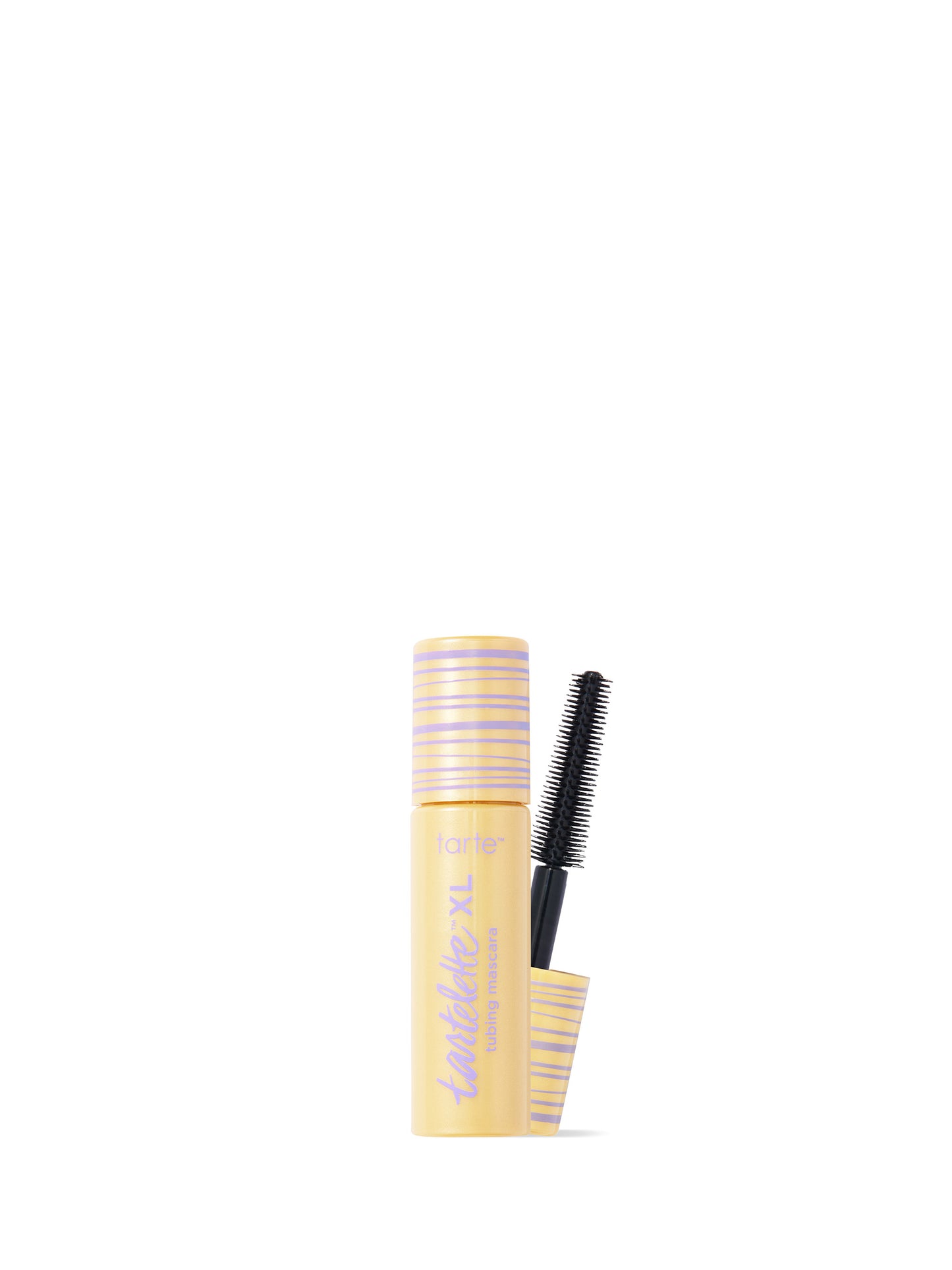 Mascara with a yellow and black brush on a white background