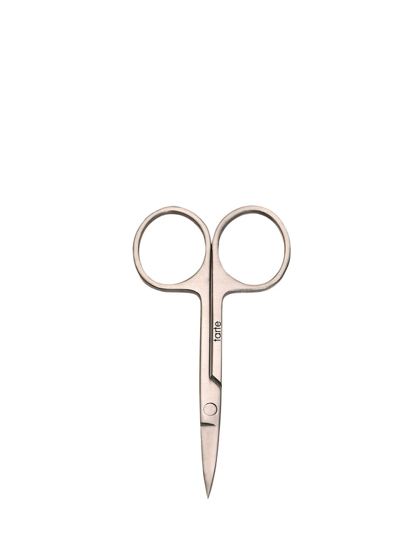 Pair of rose gold nail scissors on a white background