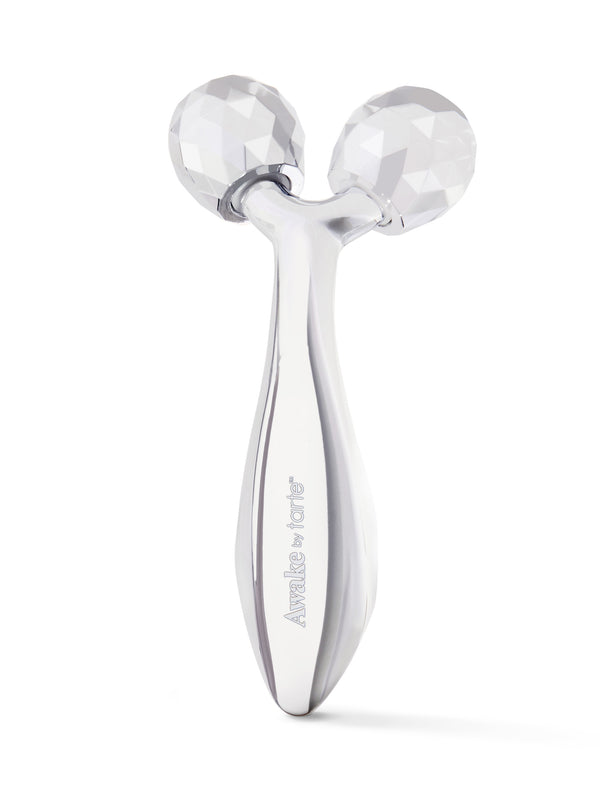 Silver facial roller with brand name on a white background