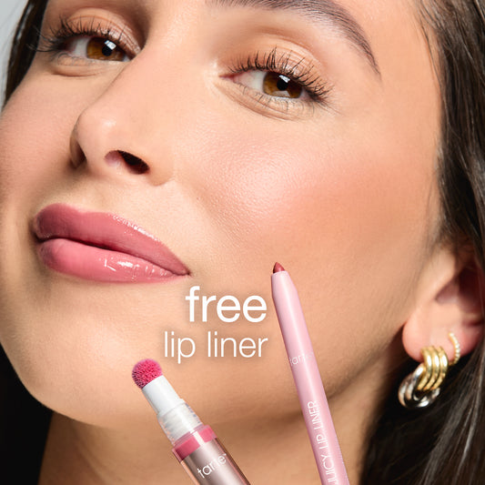 A woman's face showcases glossy lips; nearby are Tarte Cosmetics' products: a pink lip liner and lip color. Text reads free lip liner, highlighting a promotional offer.