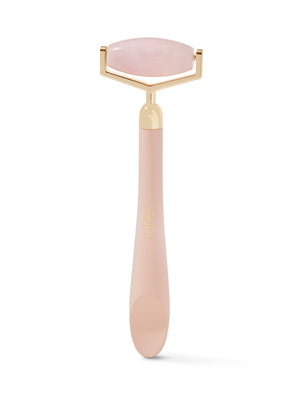 Rouleau facial rose avec gold sur fond blanc