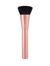 A makeup brush from Tarte Cosmetics features a rose gold handle and densely packed, dark bristles. The brush stands upright against a plain white background.