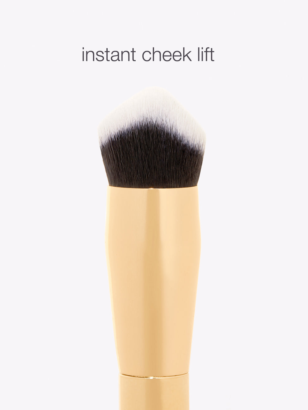Makeup brush with a tapered, angled bristle design, positioned vertically against a plain background. Text above reads: instant cheek lift.