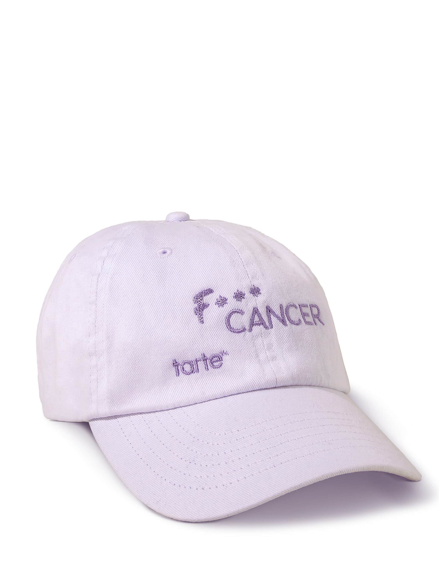 A light purple baseball cap displays the text F*** CANCER and tarte™ in purple, lying on a white background.