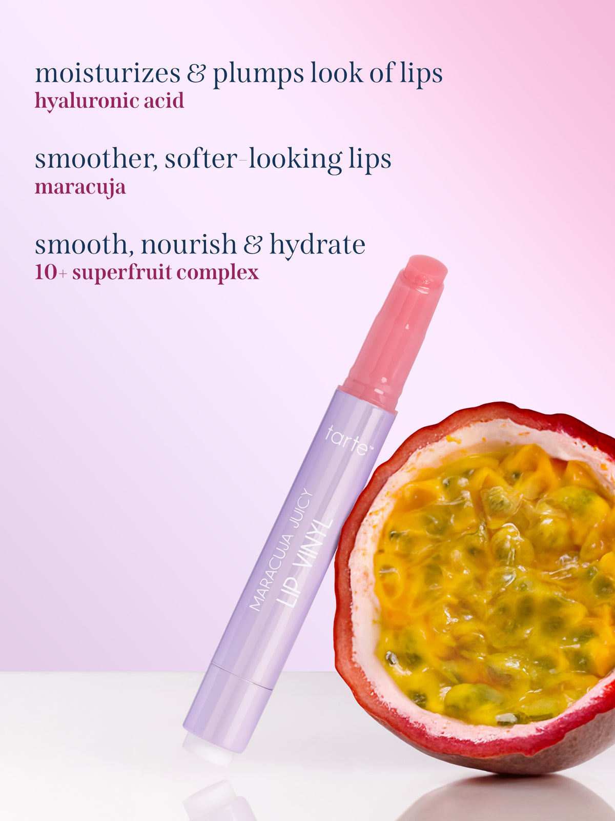 Tarte Maracuja juicy Lip vinyl, shown next to a halved passion fruit on a pink gradient background with product benefit text. hyaluronic acid, maracuja,  and 10+ superfruit complex