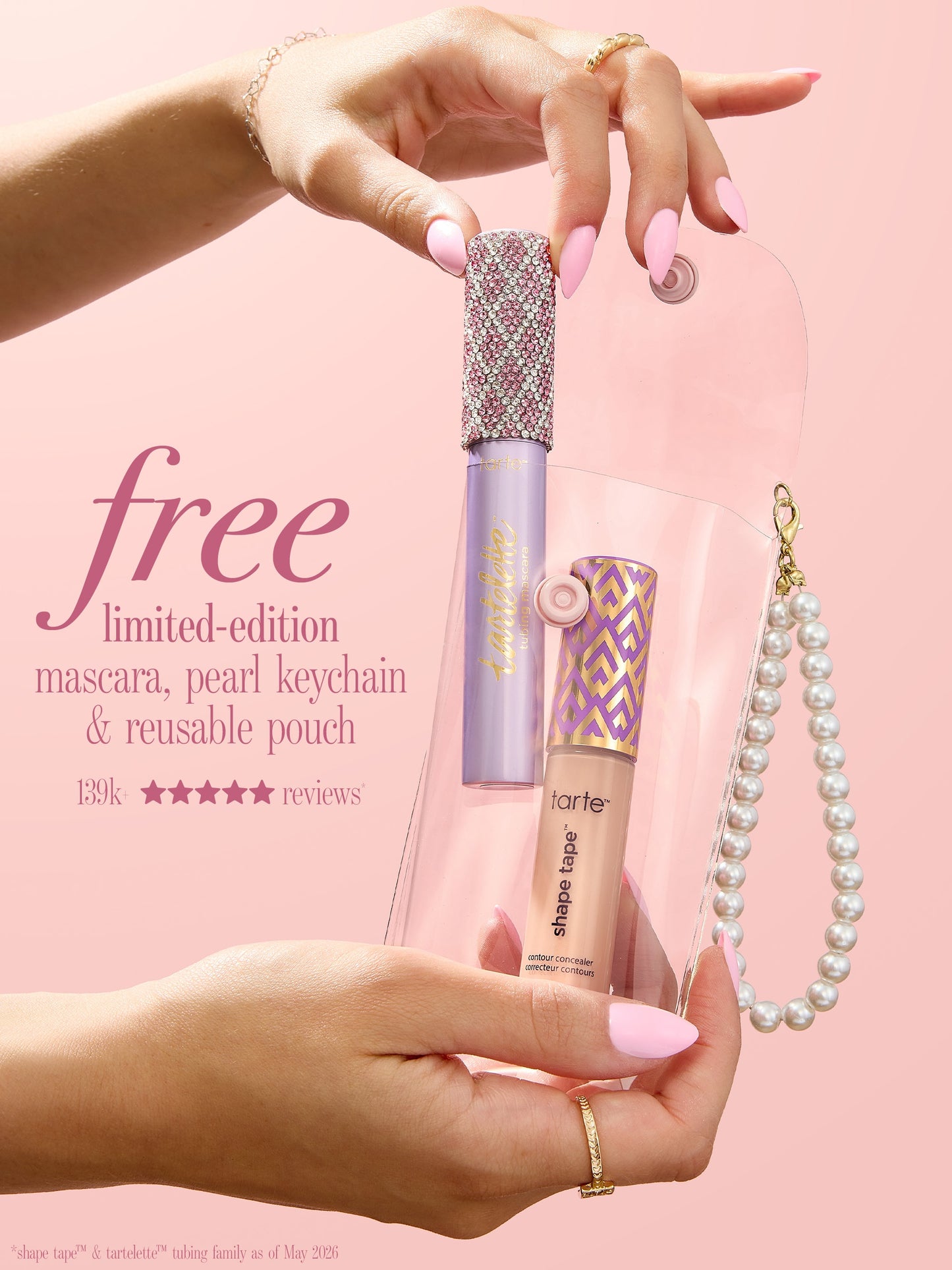 woman holding tarte cosmetics SPOTTED the icons best sellers set and free pearl keychain