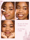 Three-panel makeup tutorial showing a woman applying tarte go with the faux freckle stamp, blending freckles, with pink text instructions on a pale pink background.