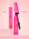 tarte big ego mascara in travel size and full size on a pink background