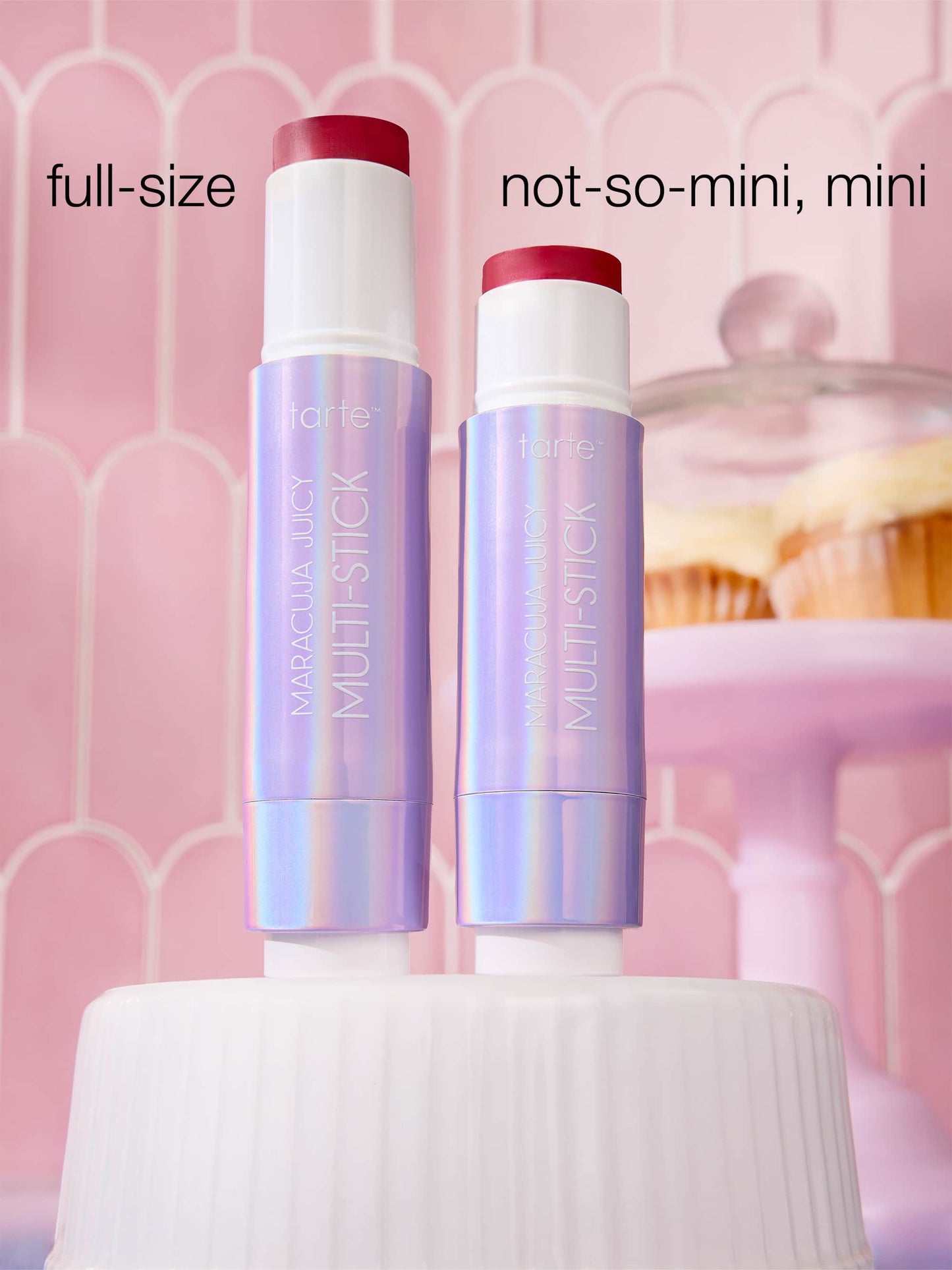 Two multistick products, one full-size and one not-so-mini, on a pink background.