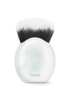 Makeup brush with black bristles on a white spherical handle featuring the tarte logo.
