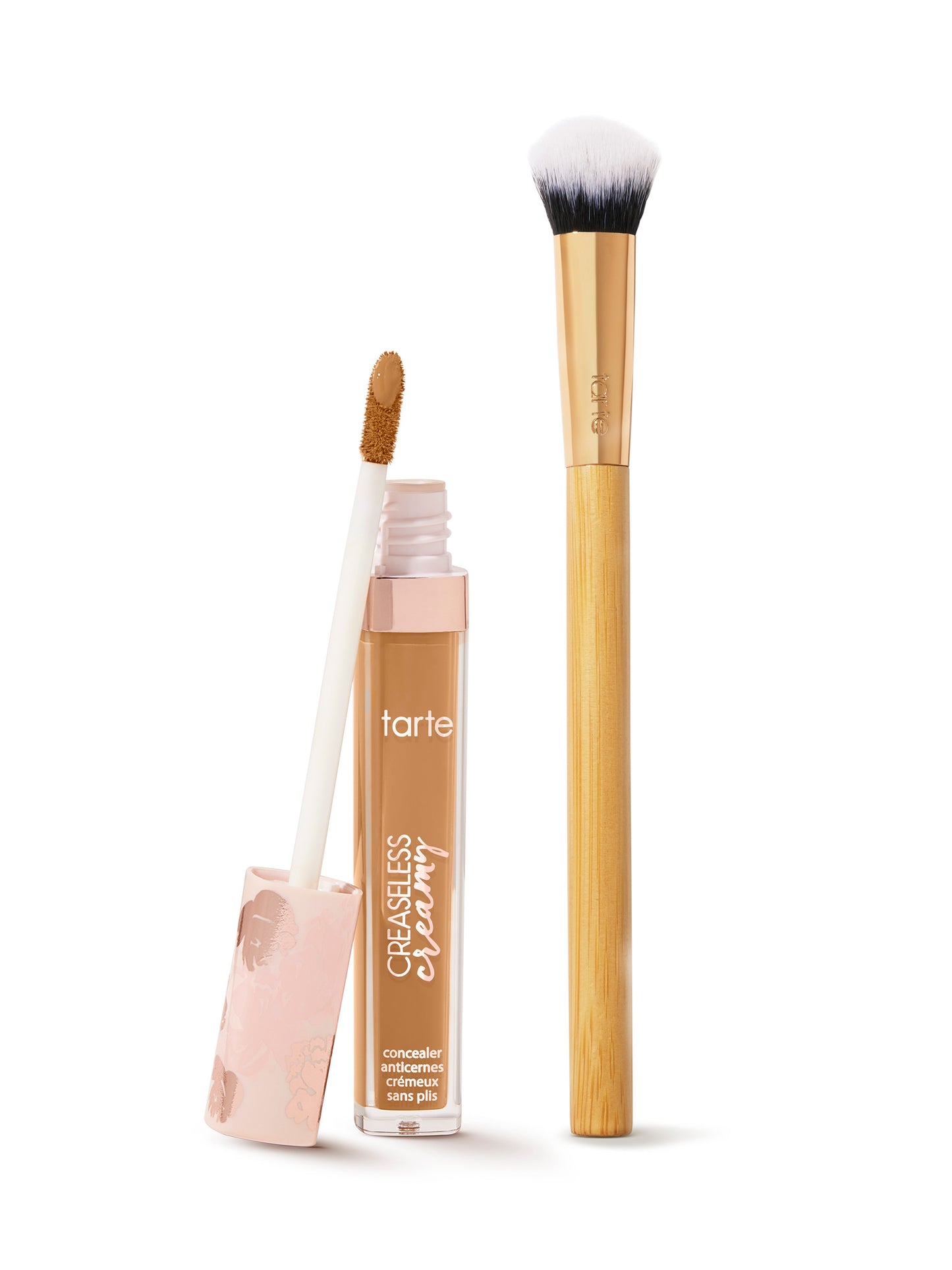 Tarte concealer with applicator and brush on a white background