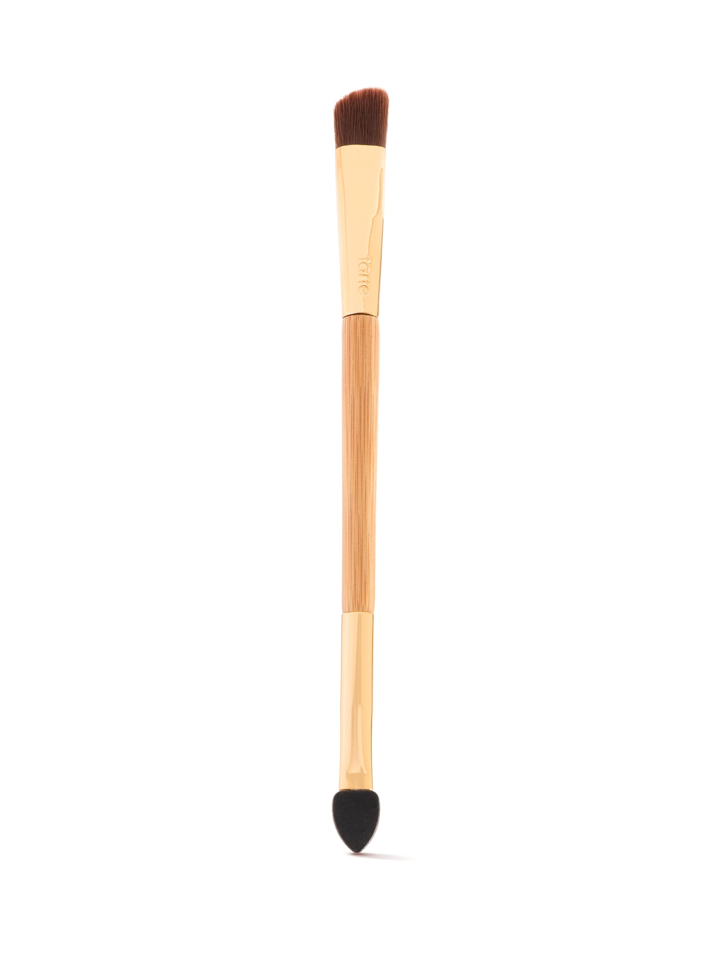 A dual-ended makeup tool with a wooden handle features a firm, angled brush on one end and a tapered sponge tip on the other, set against a plain white background.