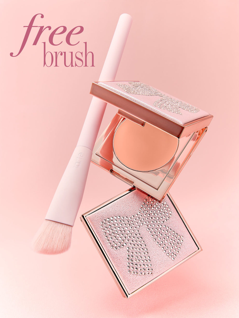 tarte cosmetics face card never declines + free brush against a pink background