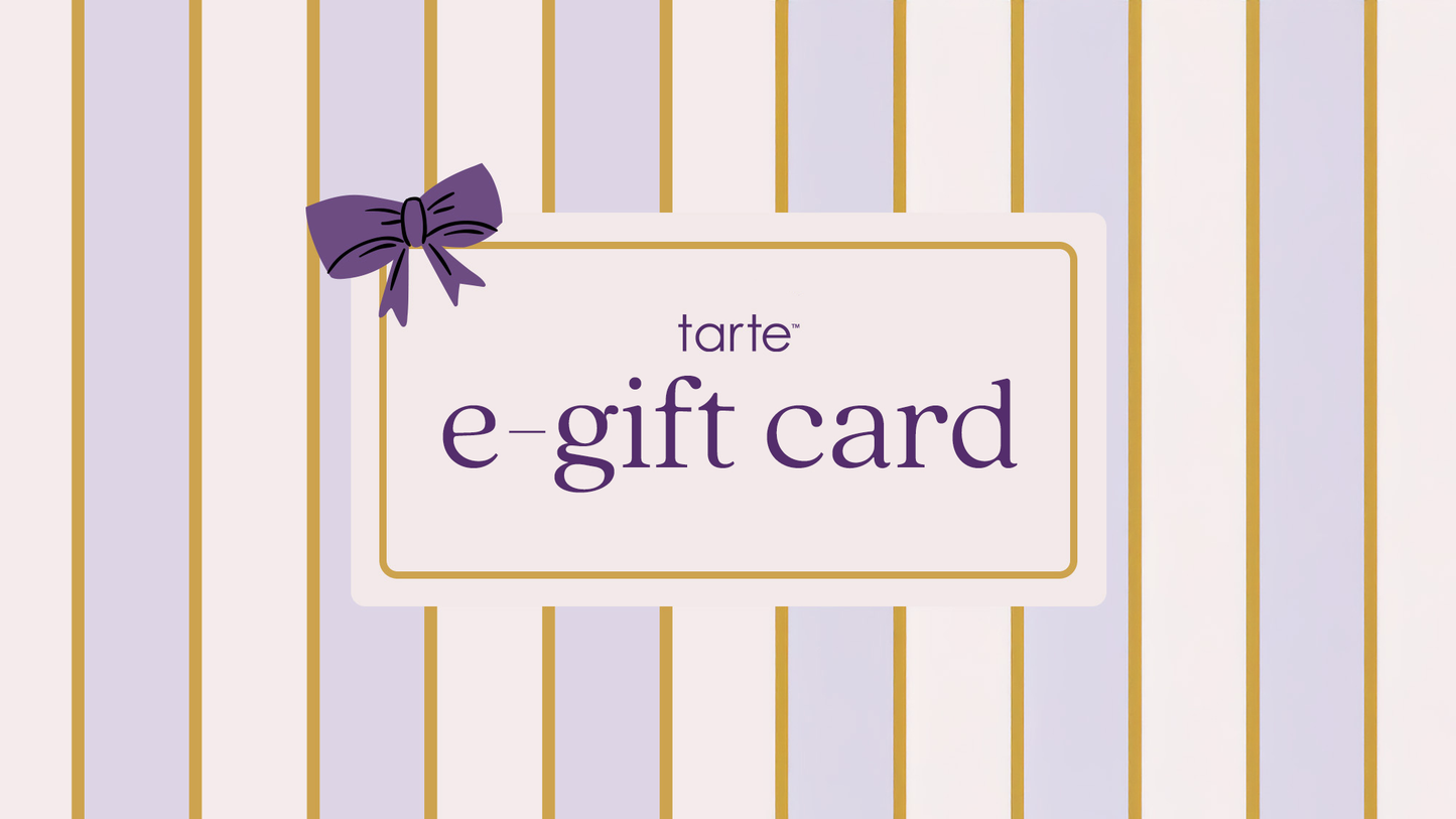 A Tarte Cosmetics e-gift card is decorated with a purple bow on a background featuring vertical pastel stripes. Text reads tarte e-gift card.