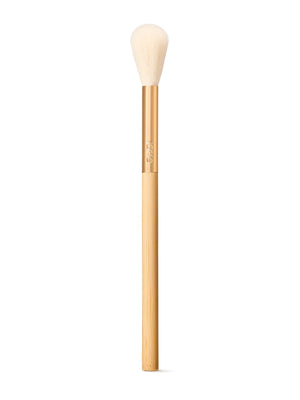 Tarte blush makeup brush with wooden handle and white bristle head on a white background