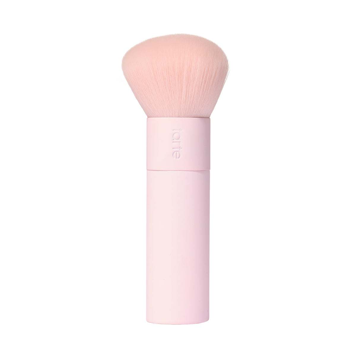 A tarte cosmetics pink makeup brush with soft, rounded bristles and a pink handle, on a white background. 