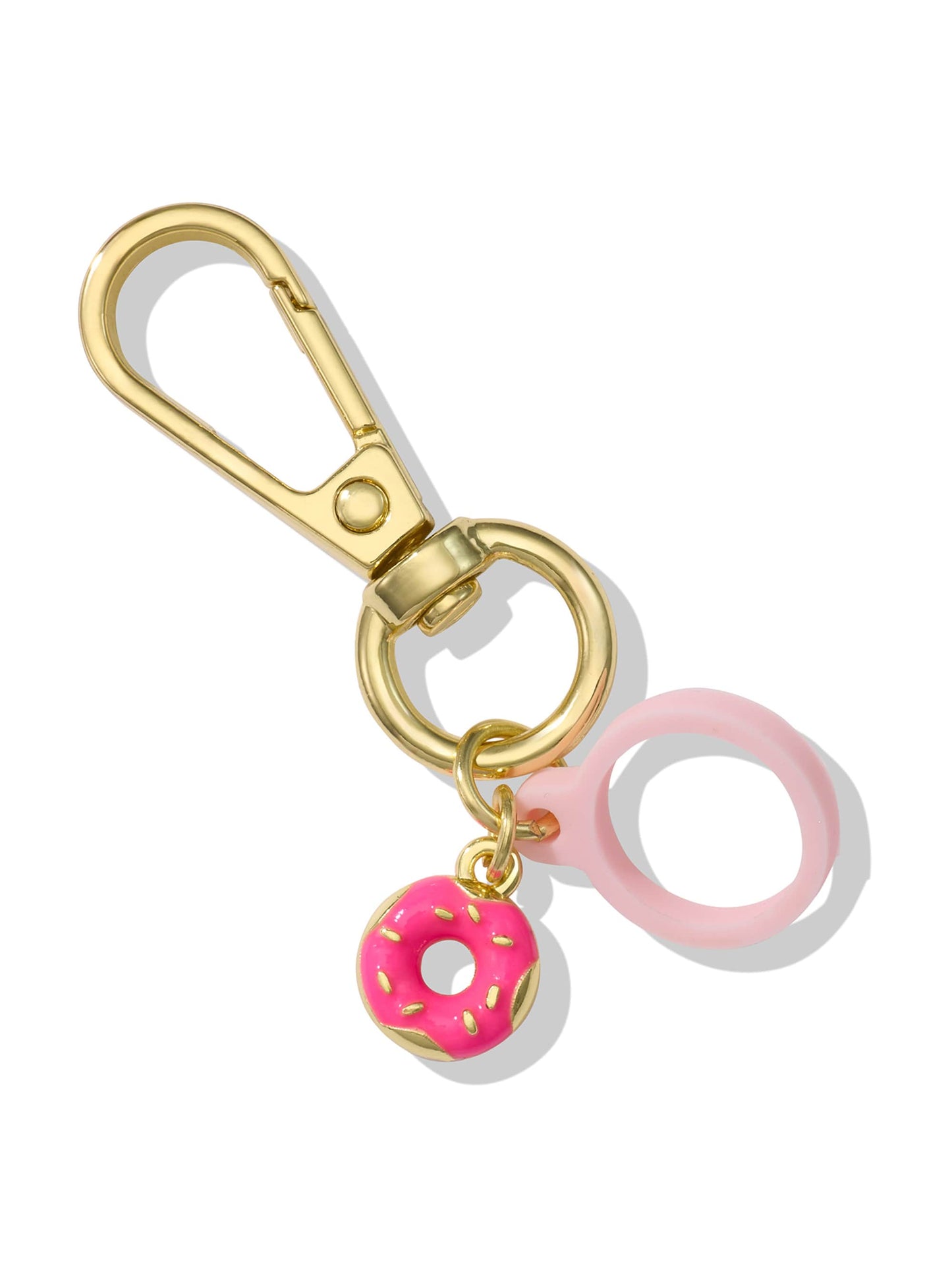 A gold keychain clip holds a pink frosted donut charm with yellow sprinkles and a pink silicone ring, all on a white background.