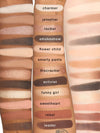 Makeup palette with color swatches labeled from 'charmer' to 'leader'.