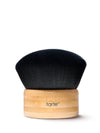 Makeup brush with black bristle head and wooden handle on a white background, featuring the tarte logo.
