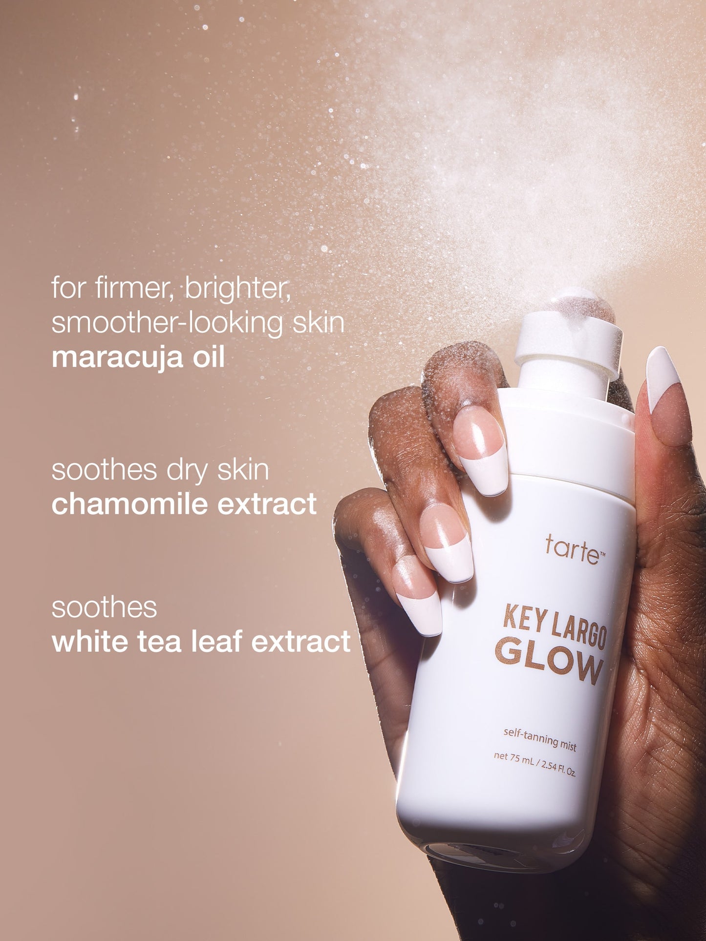 Hand holding a skincare product with text about ingredients on a beige background