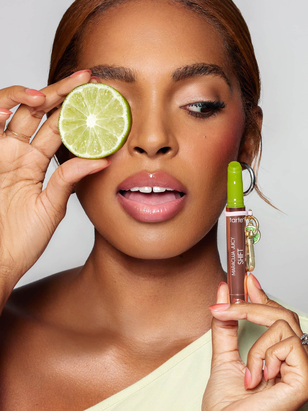 Woman holding a limited edition cosmetic product close to her face