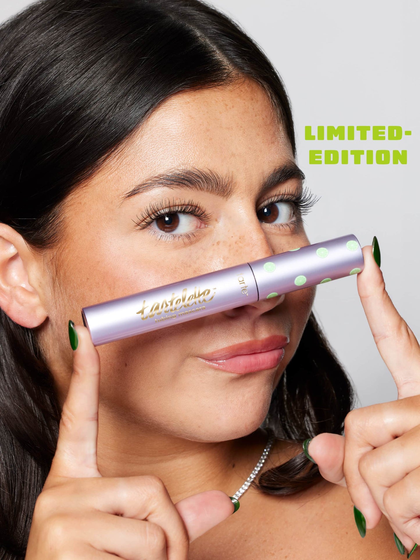 Woman holding a limited edition cosmetic product close to her face