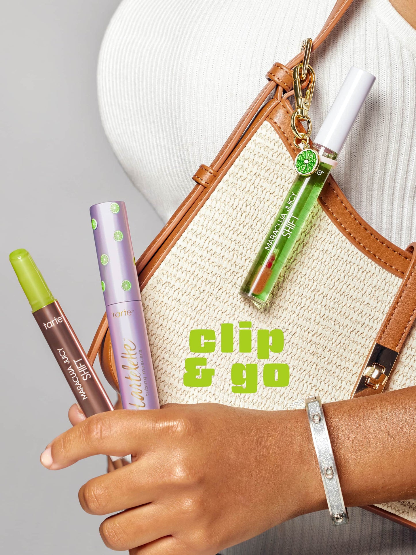 Hand holding makeup products with a bag and 'clip & go' text