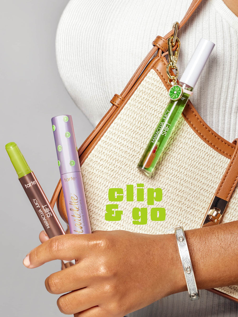 Hand holding makeup products with a bag and 'clip & go' text