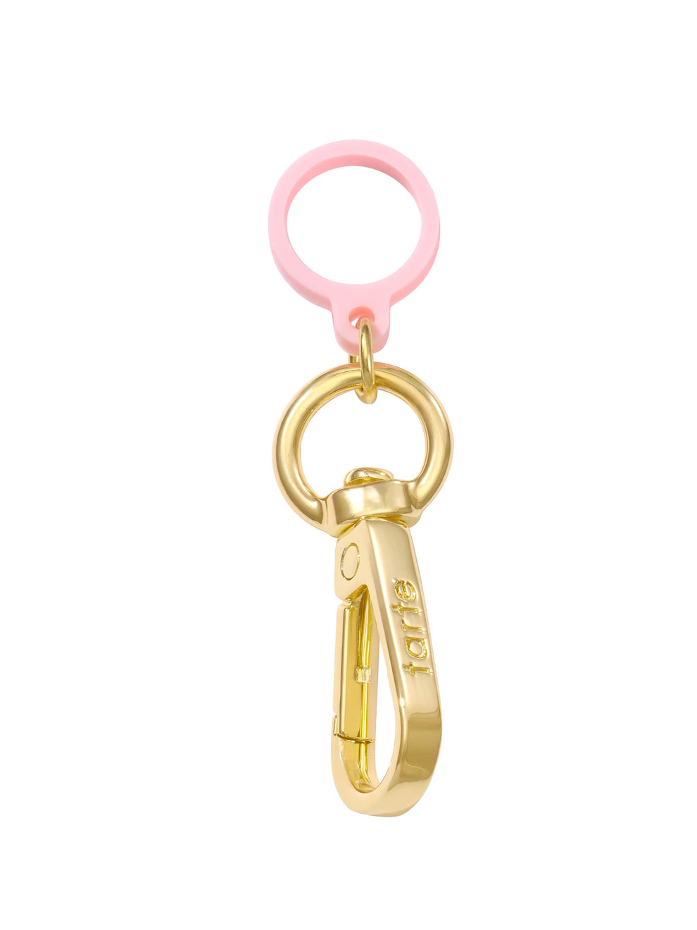 A gold keychain clip labeled tarte is attached to a gold ring with a pink silicone loop, isolated on a white background.