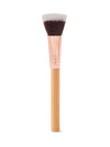Makeup brush with a flat, dual-toned bristle head, resting vertically. It features a rose gold ferrule engraved with tarte and a smooth, light wood handle, set against a plain white background.