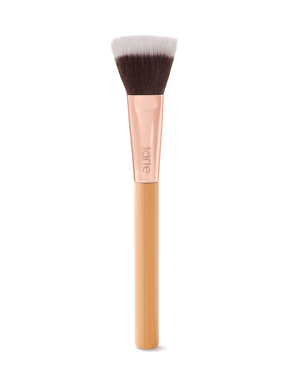 Makeup brush with a flat, dual-toned bristle head, resting vertically. It features a rose gold ferrule engraved with tarte and a smooth, light wood handle, set against a plain white background.