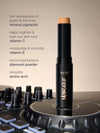 Tarte maneater foundation stick on a turntable with product details on a beige background