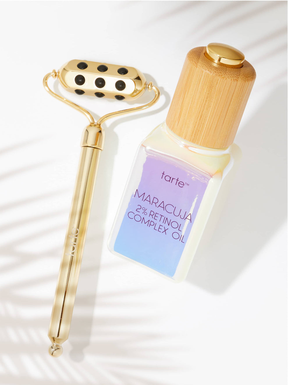 Tarte Maracuja 2% Retinol Complex Oil bottle with gold roller on a white background