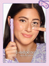 A woman removing tartelette tubing mascara with limited edition roller rabbit collab cap, with text reading '1-swipe removal' and 'removes with warm water.' 