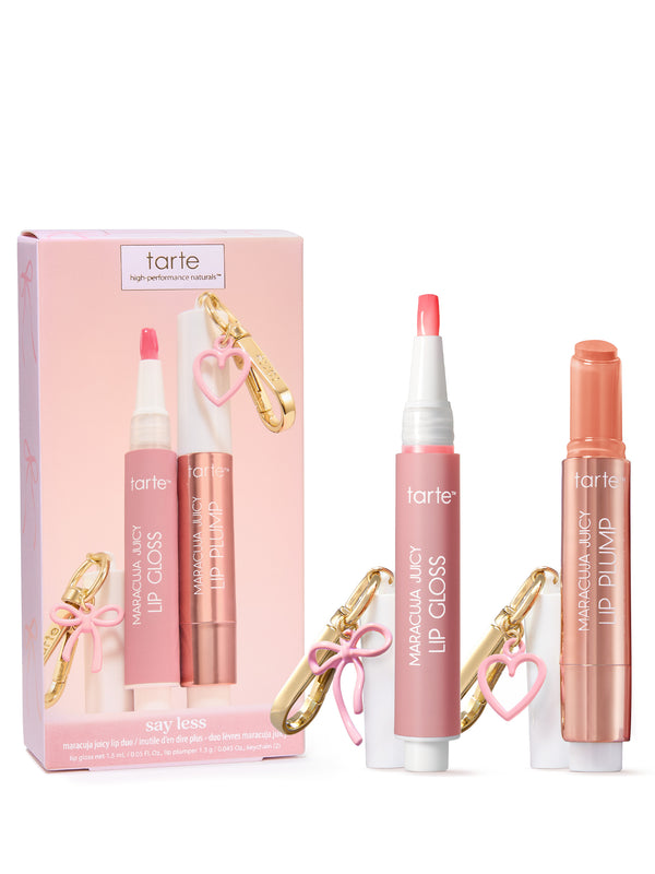 Tarte lip products displayed with pink box : a lip gloss and a lip plump, each with a gold keychain clip and pink heart charm.