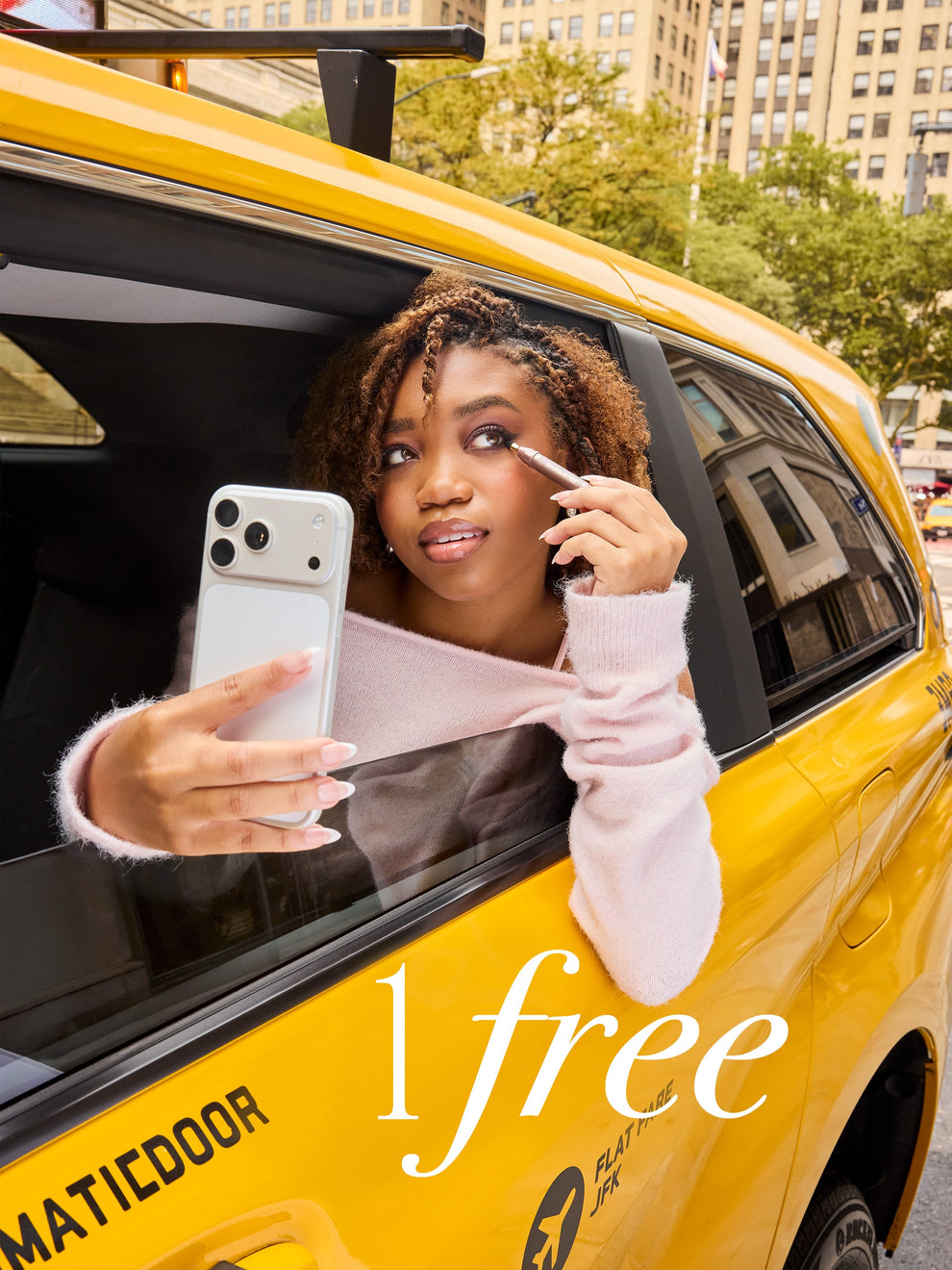 woman using tarte cosmetics smoldereyes liner trio in a yellow taxi