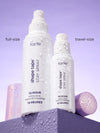 Tarte Shape Tape Stay Spray bottles in full-size and travel-size on a purple background