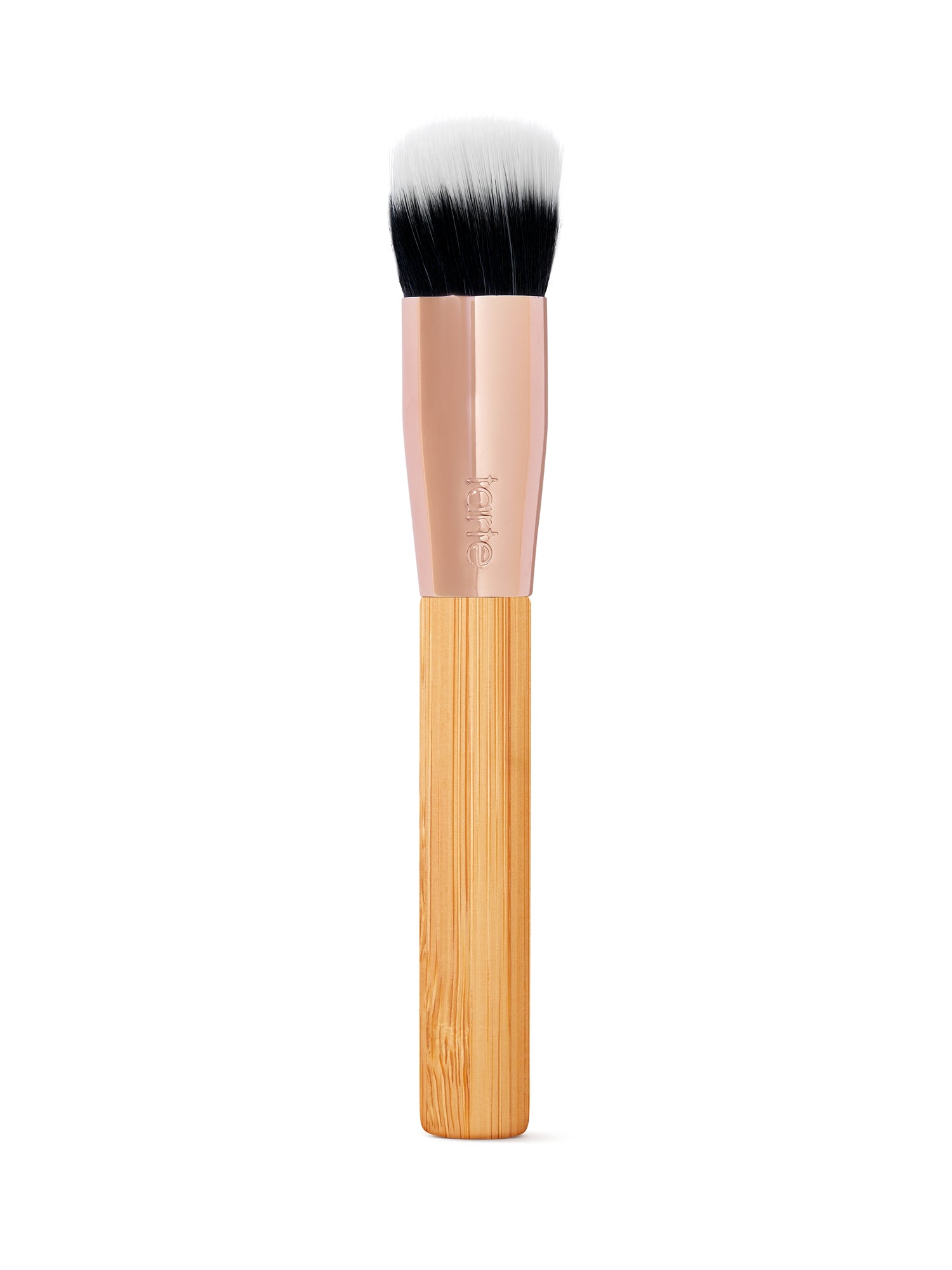Makeup brush with wooden handle and black bristles on a white background