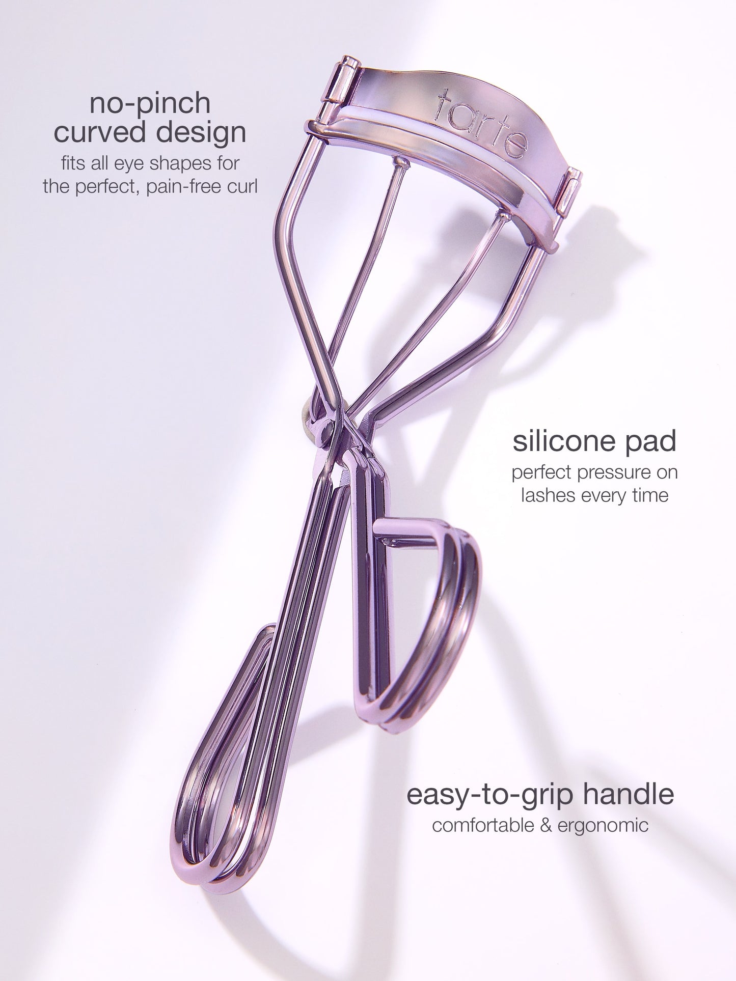 Eyelash curler with text highlighting features on a light purple background