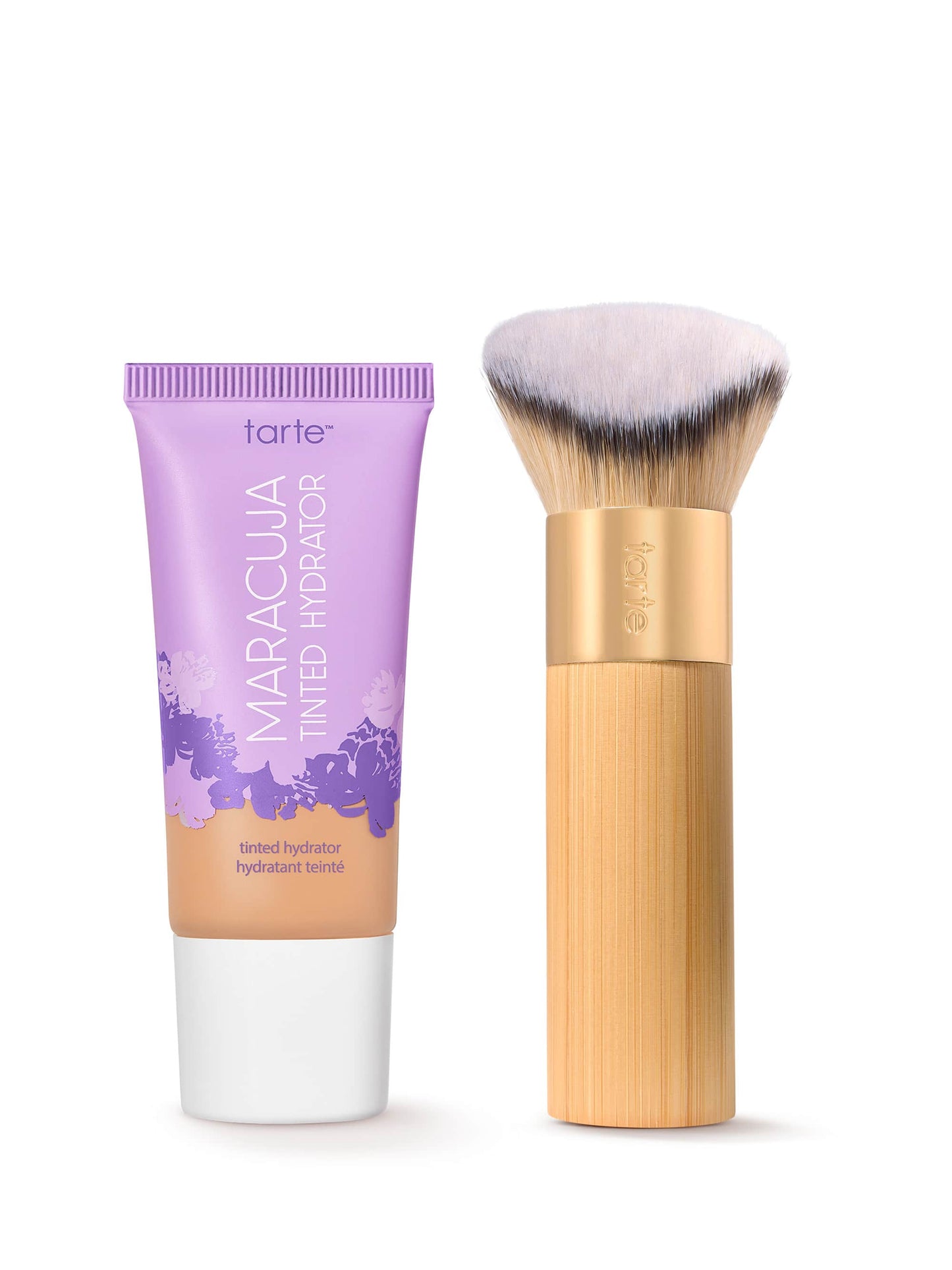 Tarte Maracuja tinted moisturizer with a bamboo-handled brush on a white background