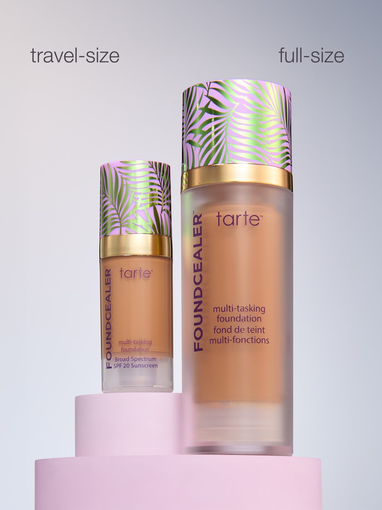 Tarte foundation bottles, one travel-size and one full-size, on a light gray background.