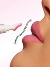 Lip balm with a curved applicator being used on lips, labeled 'custom curved lip scoop'.