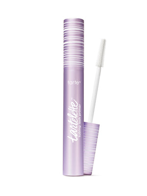 A tube of tartelette tubing lash primer with the wand applicator showing the clear product.