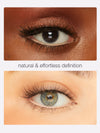 Close-up of eyes with natural makeup application on a plain background
