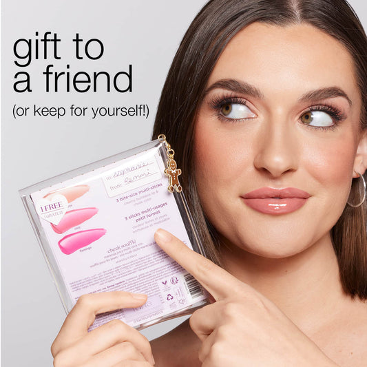 A person holds a package of Tarte Cosmetics multi-sticks, pointing to it. Text reads gift to a friend (or keep for yourself!) against a neutral background.