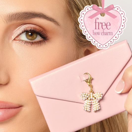 tarte cosmetics front row energy travel essentials and free bow pearl charm attatched to the eyeshadow palette