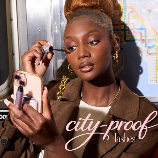 woman using tarte cosmetics tartelette XL tubing mascara 'city proof lashes'