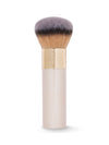 Makeup brush with gold and beige handle on a white background