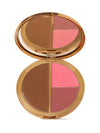 Makeup compact with brown, pink, and red shades on a white background
