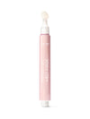 Pink face mask tube with applicator on a white background